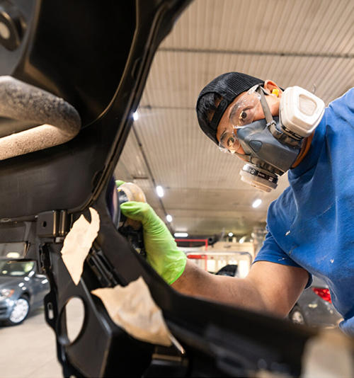Image for Current Apprentices - A young male apprentice repairing a vehicle.