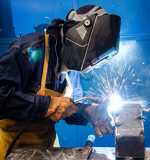 Image for Experienced Workers - A woman is welding.