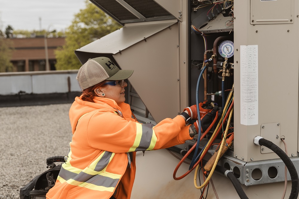 A female electrician operating powerline.